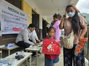 Flood survivors getting medical care and clothes from the flood relief program